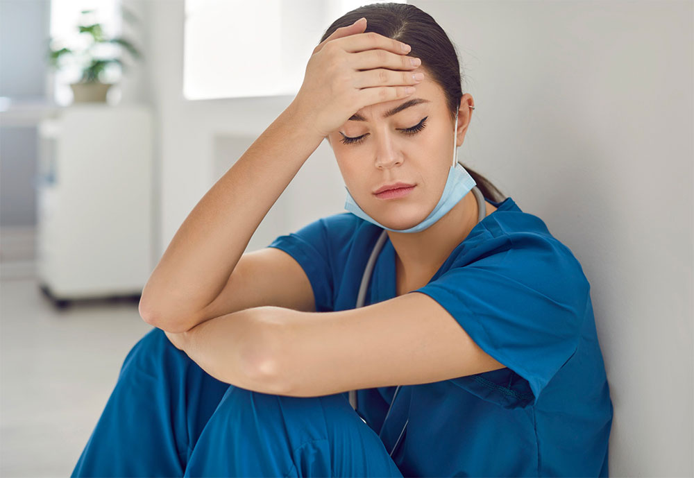 Employee struggling with burnout and workplace anxiety - LeaveConsult