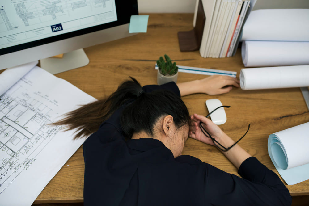 Employee struggling with burnout while working on office projects - LeaveConsult
